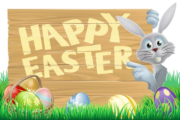 Bunny wijzend op happy easter bericht — Stockvector