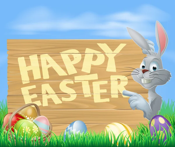 Un conejito de pascua de dibujos animados con una cesta de huevos de pascua junto a un letrero de madera Stock vektory, Royalty Free Un conejito de pascua de dibujos animados con Un conejito de pascua de dibujos animados con una cesta de huevos de pascua junto a un letrero de madera Stock vektory, Royalty Free Un conejito de pascua de dibujos animados con