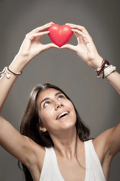 Holding a red heart Stock Photo