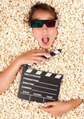 young girl buried in popcorn clipart