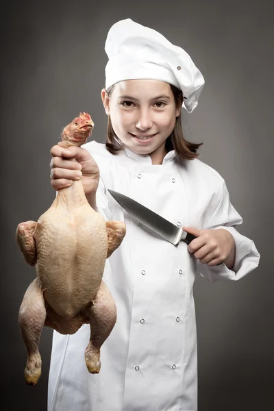 Chef-kok houden een kip — Stockfoto