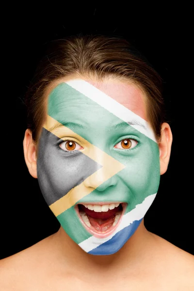 Девушка с южноафриканским флагом на лице — стоковое фото