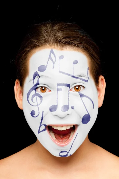 Ragazza con note musicali dipinte sul viso — Foto Stock