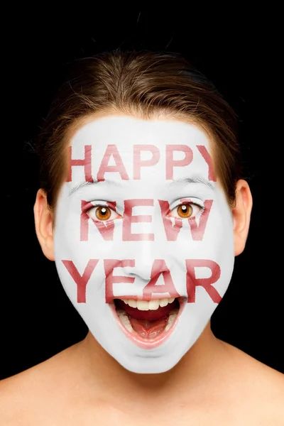 Girl with happy new year on her face — Stock Photo, Image