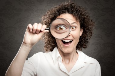 woman looking through magnifying glass clipart
