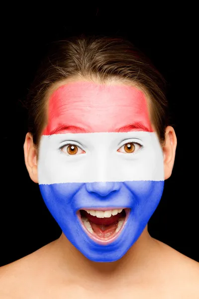 Meisje met Nederland vlag geschilderd op haar gezicht — Stockfoto