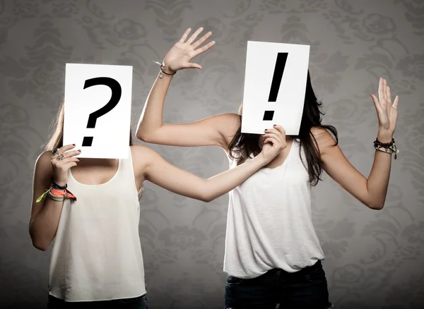 Young women with interrogation symbols — Stock Photo, Image