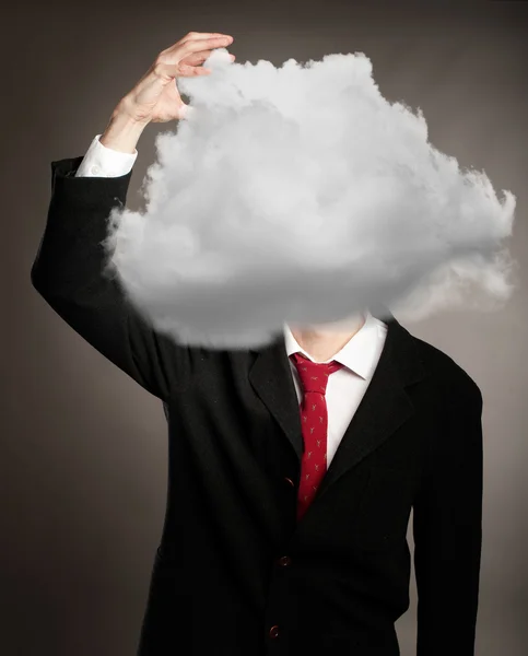 Affärsman med moln — Stockfoto