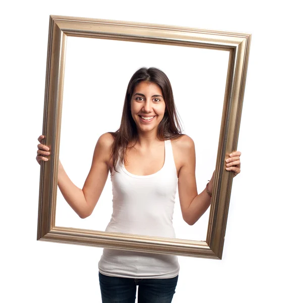 Mujer joven sosteniendo un marco — Foto de Stock