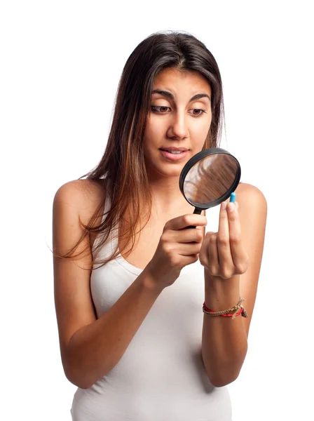 Young woman looking a pill — Stock Photo, Image