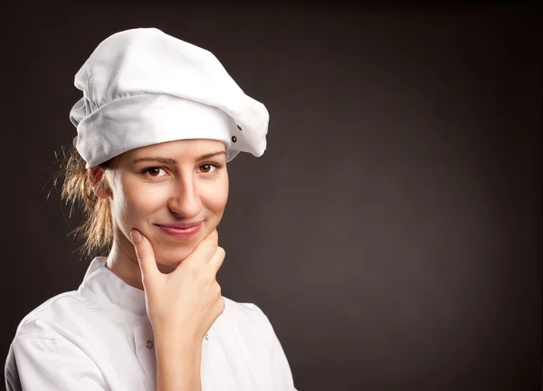 Mladá žena kuchařka — Stock fotografie