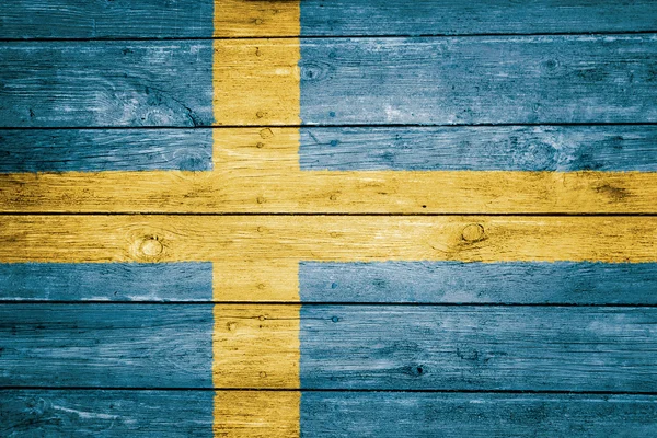 Schwedische Flagge auf Holzstruktur — Stockfoto