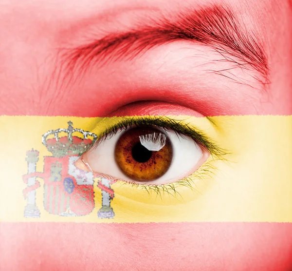 Menina com bandeira espanhola pintada — Fotografia de Stock