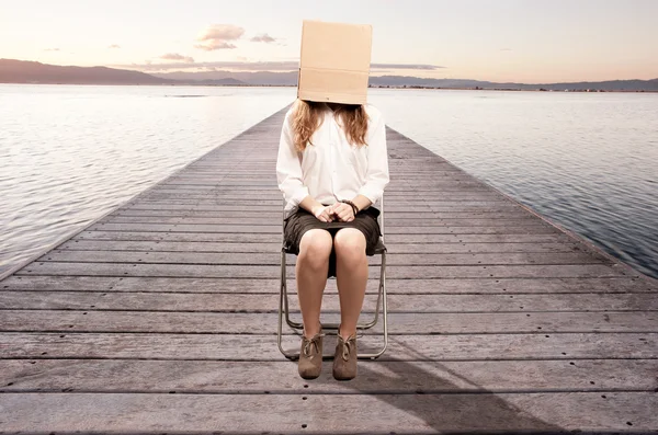 Woman with a box in her face — Stock Photo, Image