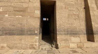 back view of woman visiting the Temple of Philae dedicated to Isis, goddess of love. Aswan. Egyptian. High quality 4k footage