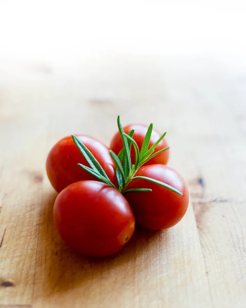 Cherry tomatoes on cutting board — Stock Photo, Image