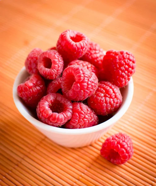 Raspberries in bowl — Stock Photo, Image