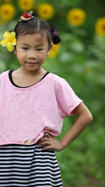 Beautiful child with sunflower — Stock Photo, Image