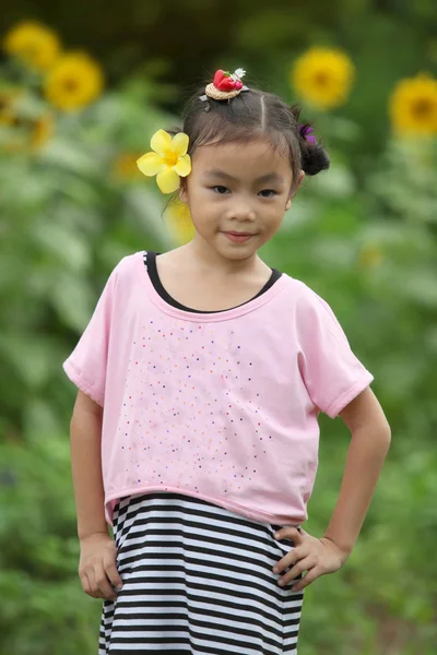 Beautiful child with sunflower — Stock Photo, Image