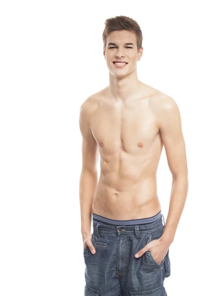 Man och stilig poserar i jeans — Stockfoto