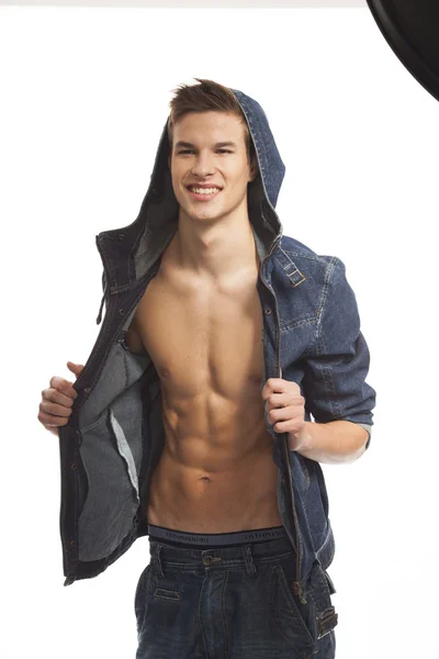 Muscle sexy young man and handsome posing in jeans — Stock Photo, Image