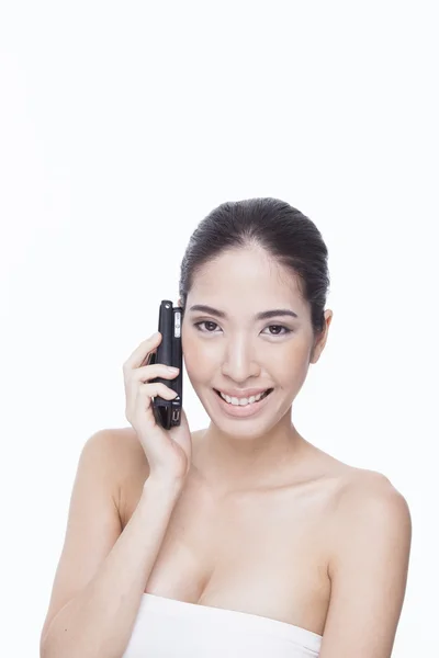 Schöne Frau mit einem Telefon — Stockfoto