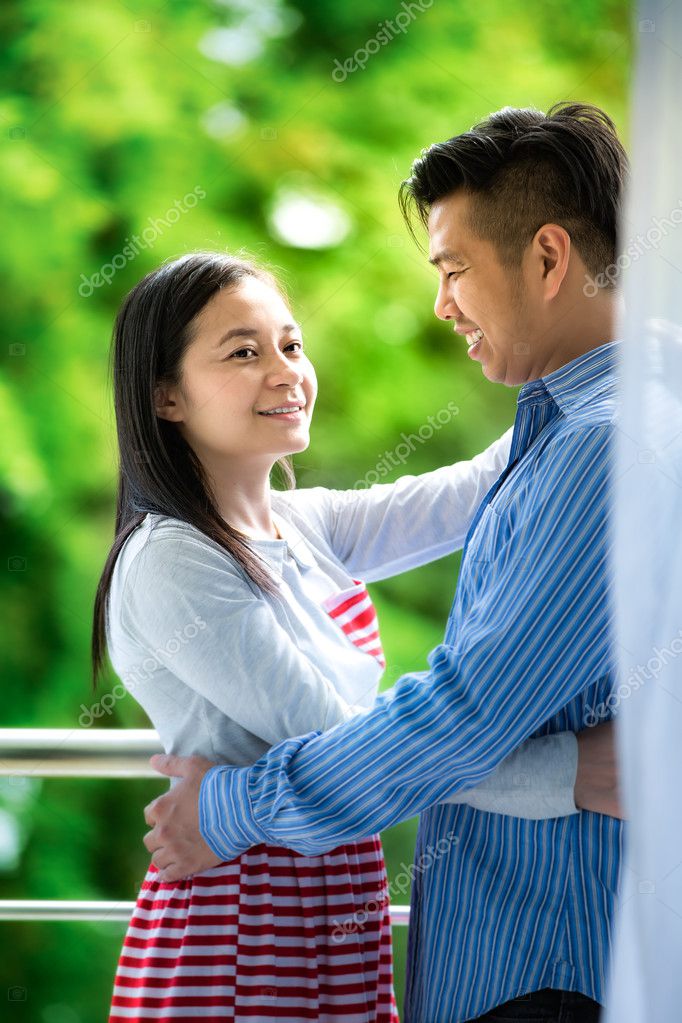 Outdoor watching asian couple