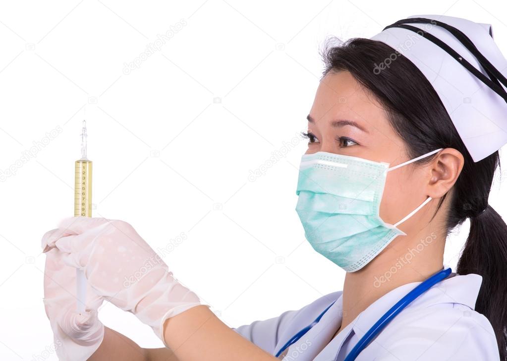 Nurse with medical syringe 