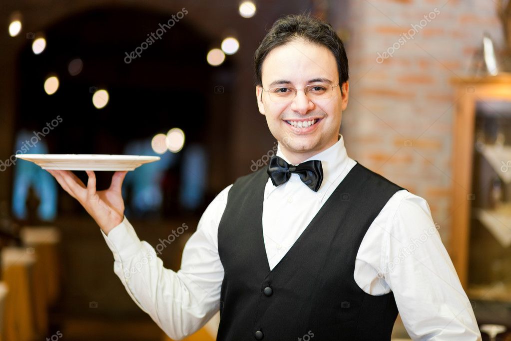 Waiter holding a plate — Stock Photo © minervastock 22873922