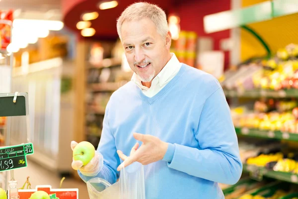 Man in a supermarket — Stock Photo, Image