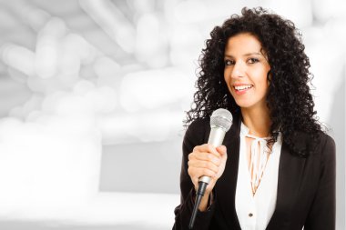 Woman speaking in a microphone clipart