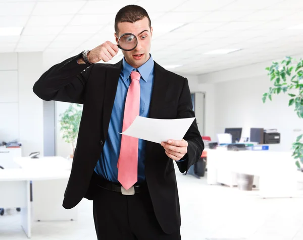 Shocked businessman reading a document — Stock Photo, Image