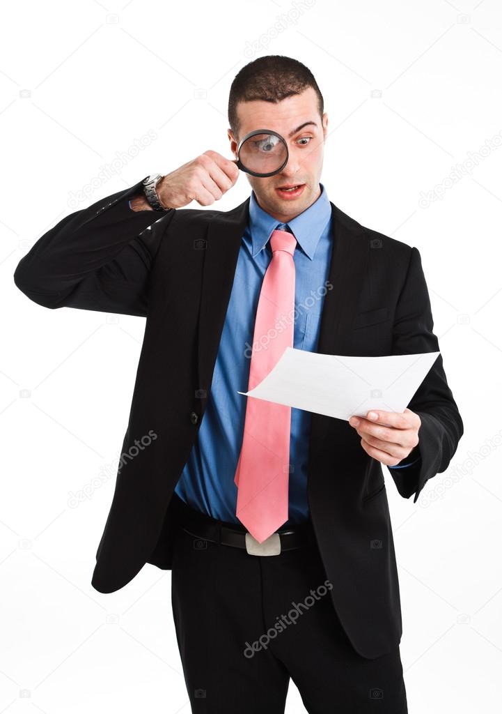 Shocked businessman reading a document