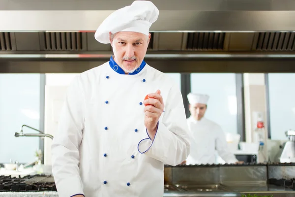 Chef cooking in his kitchen — Stock Photo, Image