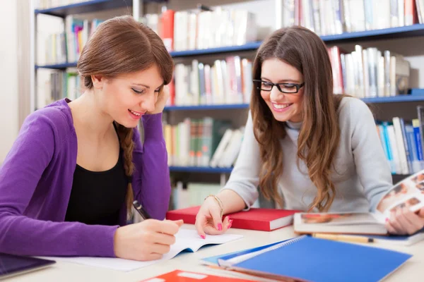 Students at work in a library Royalty Free Stock Photos