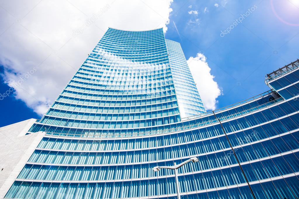 Modern skyscraper against blue sky