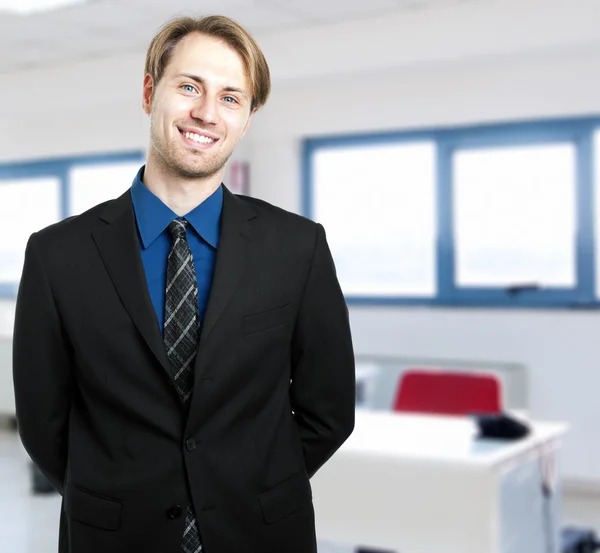 Confident young businessman in his office — Stock Photo, Image