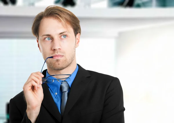 Thoughtful businessman in his office — Stock Photo, Image