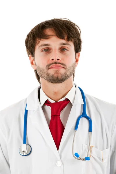 Young handsome doctor isolated on white with a stethoscope — Stock Photo, Image