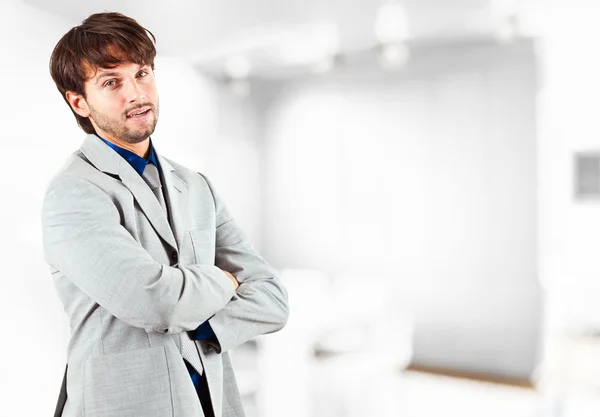 Young handsome businessman in his office — Stock Photo, Image