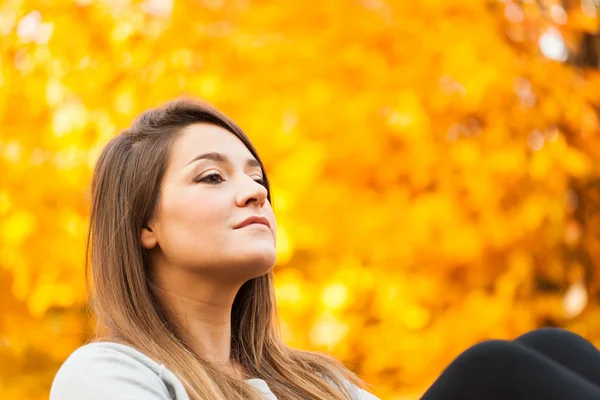 Woman relaxing in autumn — Stock Photo, Image