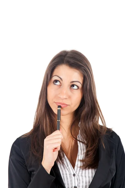 Thoughtful businesswoman holding a pen near her mouth — Stock Photo, Image