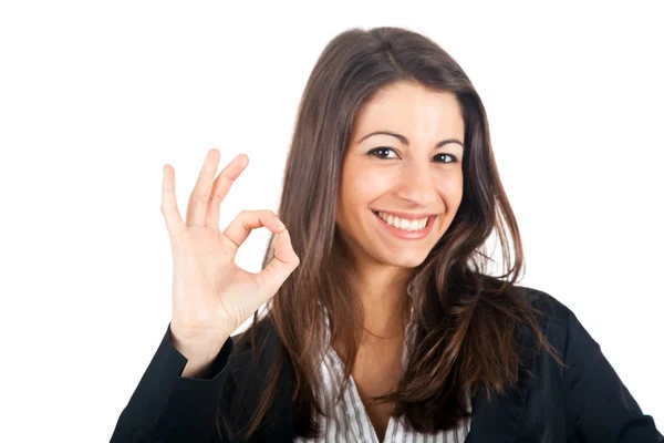 Portrait of beautiful girl showing OK sign Stock Picture