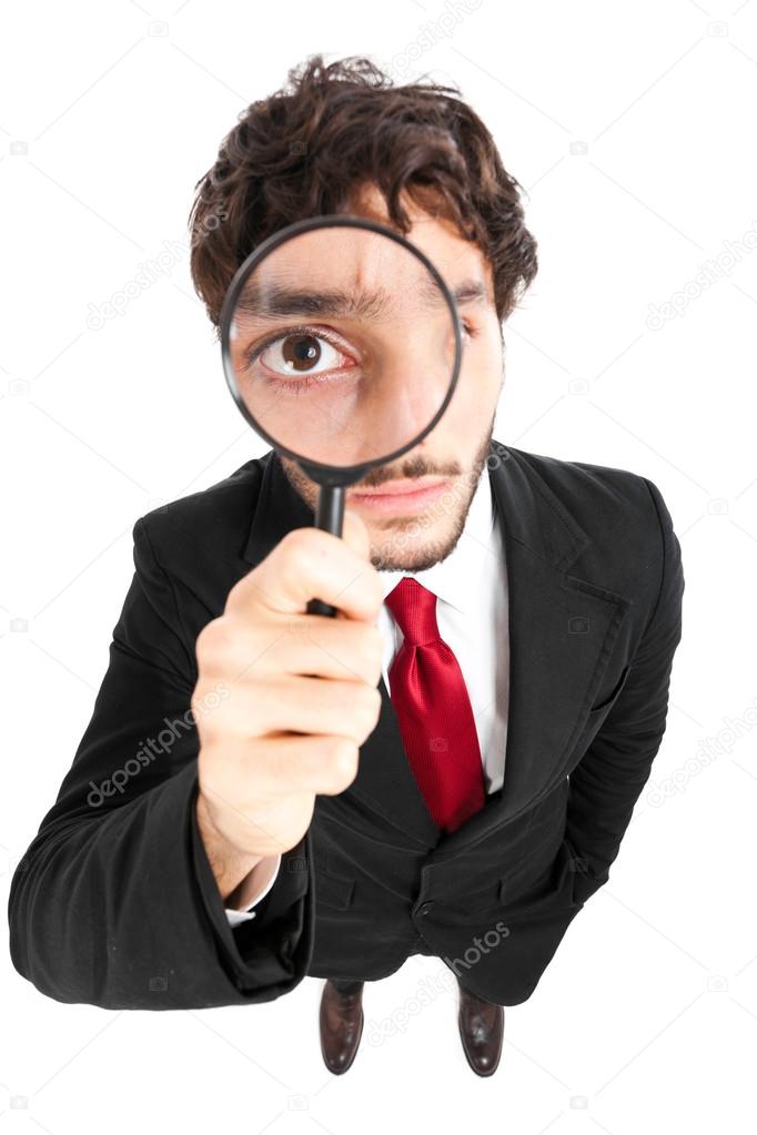 Man looking through a lens