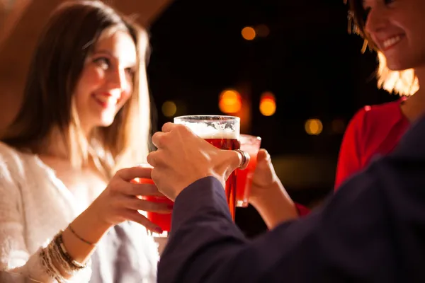 Friends having a round of drinks — Stock Photo, Image