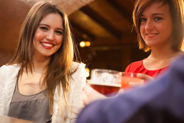 Friends having a round of drinks — Stock Photo, Image