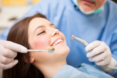 Dentist doing a treatment clipart