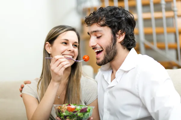 Woman lovely feeding her boyfriend Royalty Free Stock Images