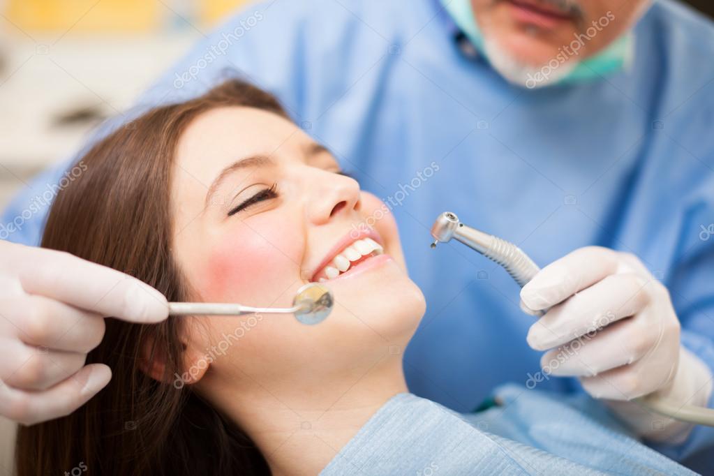 Dentist doing a treatment — Stock Photo © minervastock 30021887