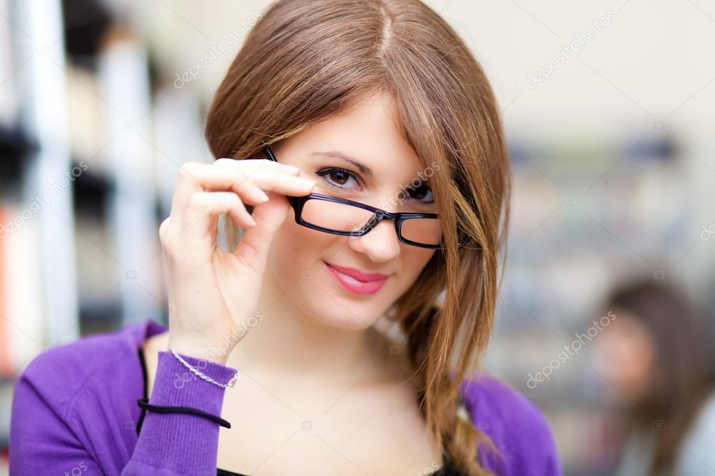 Beautiful female student portrait wearing eyeglasses